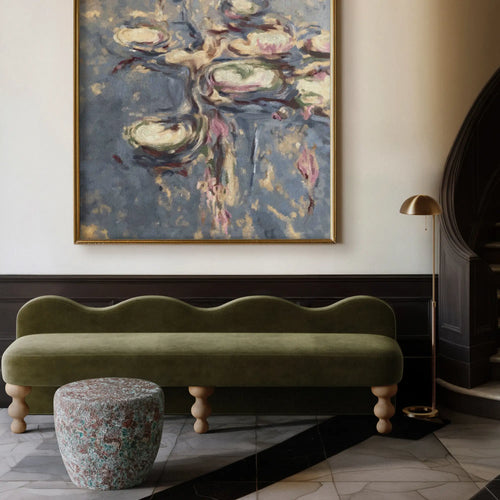 A room with a large abstract painting on the wall with green Celine bench paired with the Taiko Stool / End Table in Oxidized Jade reactive glaze with rounded form and aged-metal green and oxblood tones. 