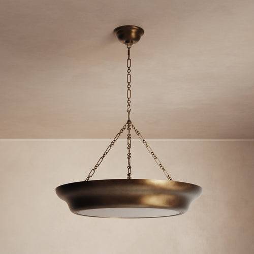 Lemieux et Cie Lenoir Chandelier, sculptural iron bowl form pendant in matte finish, suspended by chain against neutral plaster ceiling and walls