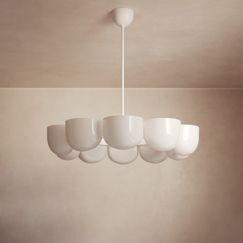 Lemieux et Cie Cheverny Chandelier with sculptural bowl shades in warm ivory, suspended from ceiling in soft neutral interior.