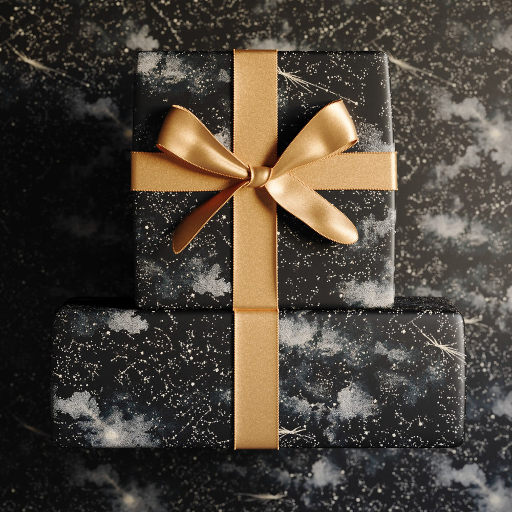 Lemieux et Cie Cosmos luxury wrapping paper with constellation pattern on black, celestial night sky designer gift wrap.
