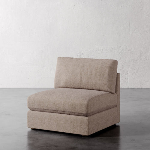 Lemieux Et Cie Chanaux Armless Chair
Beige armchair on a gray floor with a white textured wall background