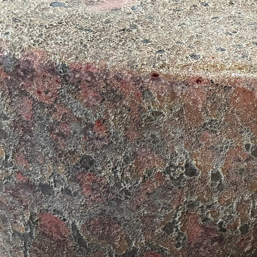 Close up of the glaze texture of the Ember Ash ceramic stool and end table with reactive glaze. Handmade for indoor and outdoor use. 