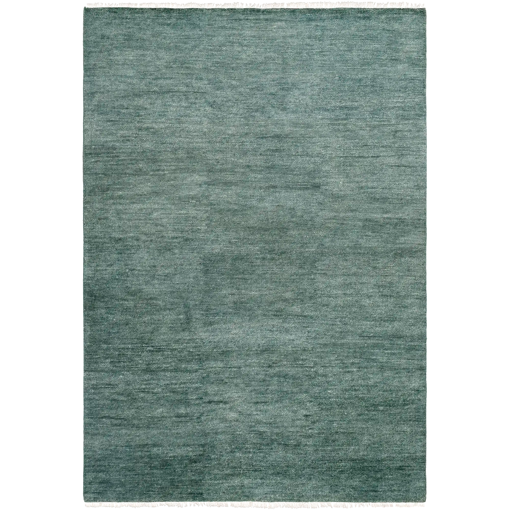 Lemieux et Cie Rochefort Handmade Wool Rug in soft teal, hand-knotted rectangular rug with subtle fringe, shown on white studio backdrop.