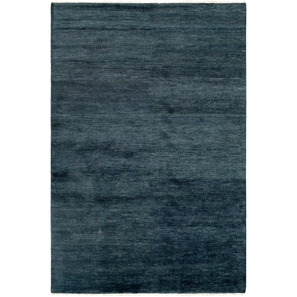 Lemieux et Cie Rochefort Handmade Wool Rug in indigo, hand-knotted rug with medium pile and subtle tonal variation, shown on white studio backdrop.