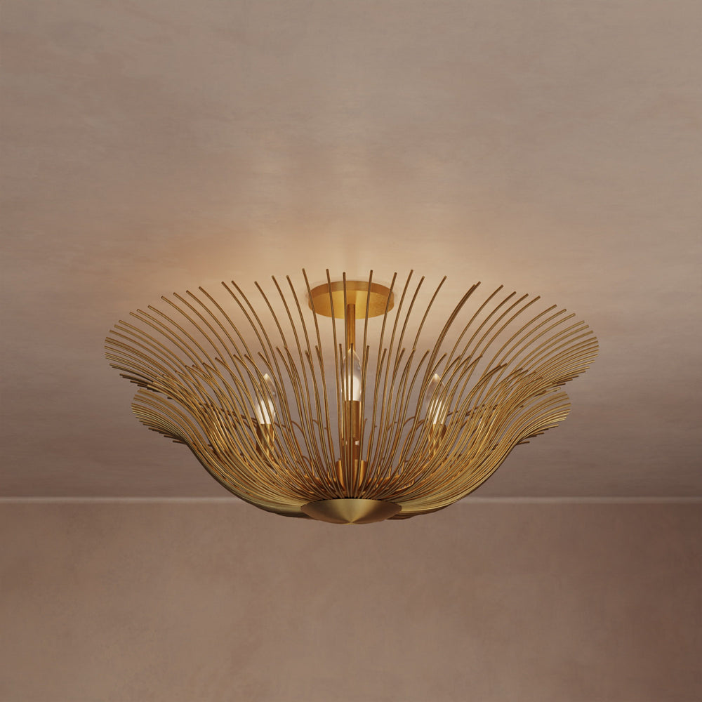 Lemieux et Cie Dorelle Flush Mount in hand-gilded brass, sculptural ceiling fixture with radiating petals, shown against neutral plaster ceiling in warm light.