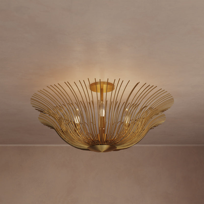 Lemieux et Cie Dorelle Flush Mount in hand-gilded brass, sculptural ceiling fixture with radiating petals, shown against neutral plaster ceiling in warm light.