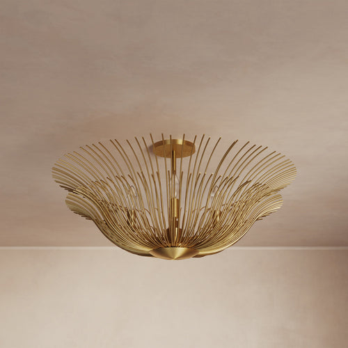 Lemieux et Cie Dorelle Flush Mount, sculptural hand-gilded brass with radiating petals, ceiling light shown against neutral plaster ceiling and walls.