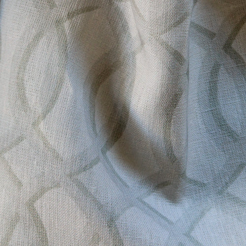 close up of Linen luxury fabric with ecru-on-white architectural lattice pattern on linen with natural slub texture
