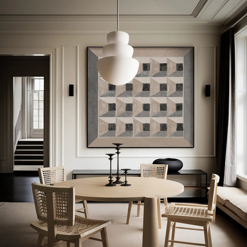 Lemieux et Cie vintage Paris map in black, white and primary colors, newly gallery-framed artwork, hung in dining room with neutral paneled walls and wood flooring.