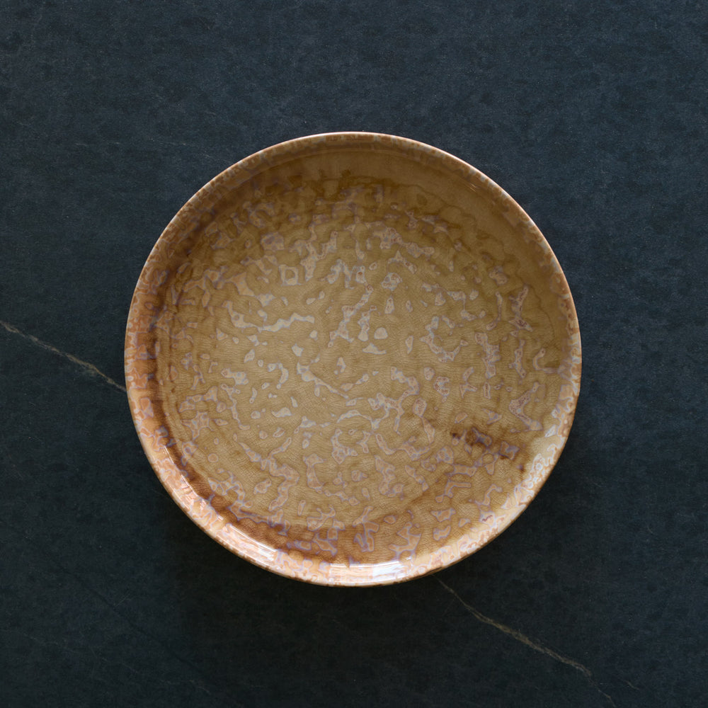 Lemieux et Cie Hanami Stoneware Salad Plate in Sand, reactive glaze with organic tonal variation, shown on dark stone surface