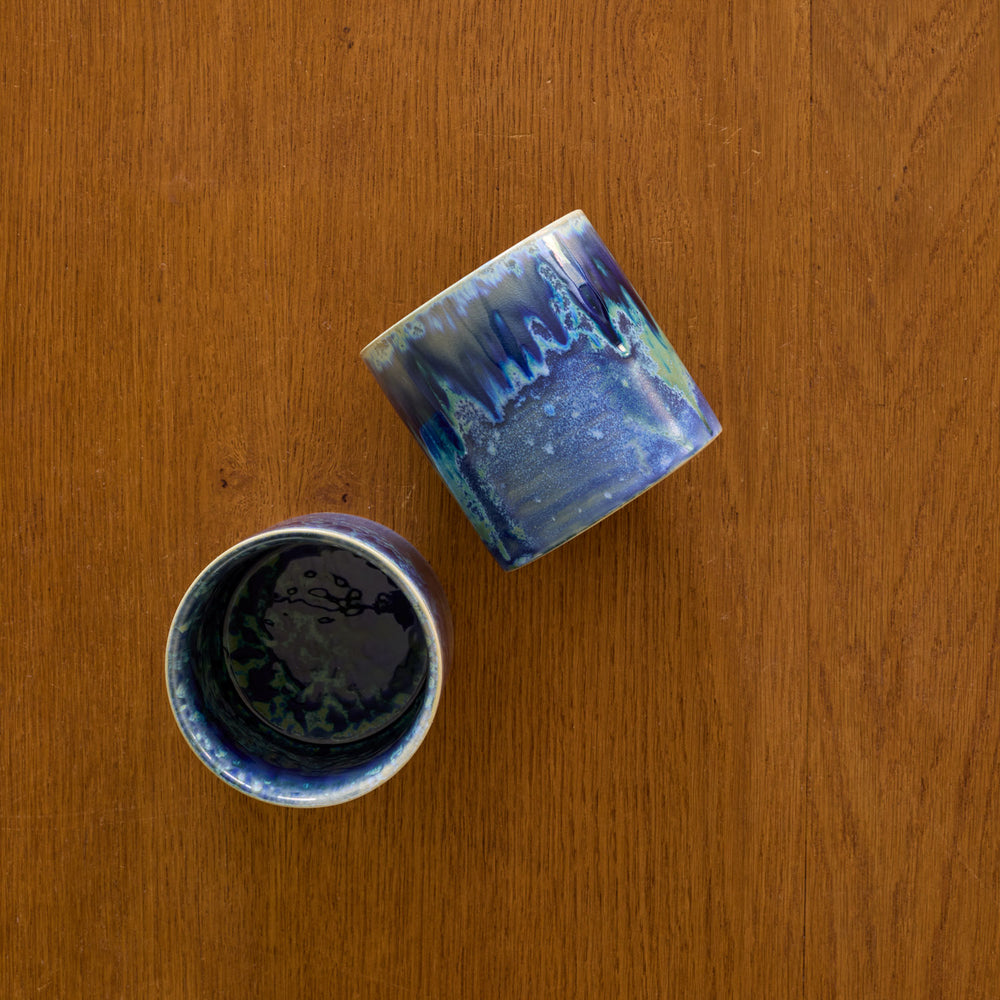 Lemieux et Cie Hanami Stoneware Mug Set in indigo, ceramic drinkware with reactive glaze, shown on warm wood surface.