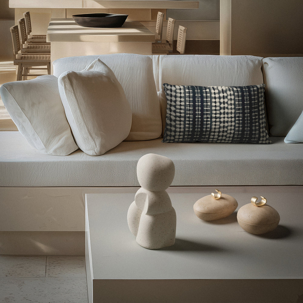 Lemieux et Cie Imane Organic Sculpture, stacked sculptural form in warm ivory, styled on coffee table with warm accents in neutral sitting room.