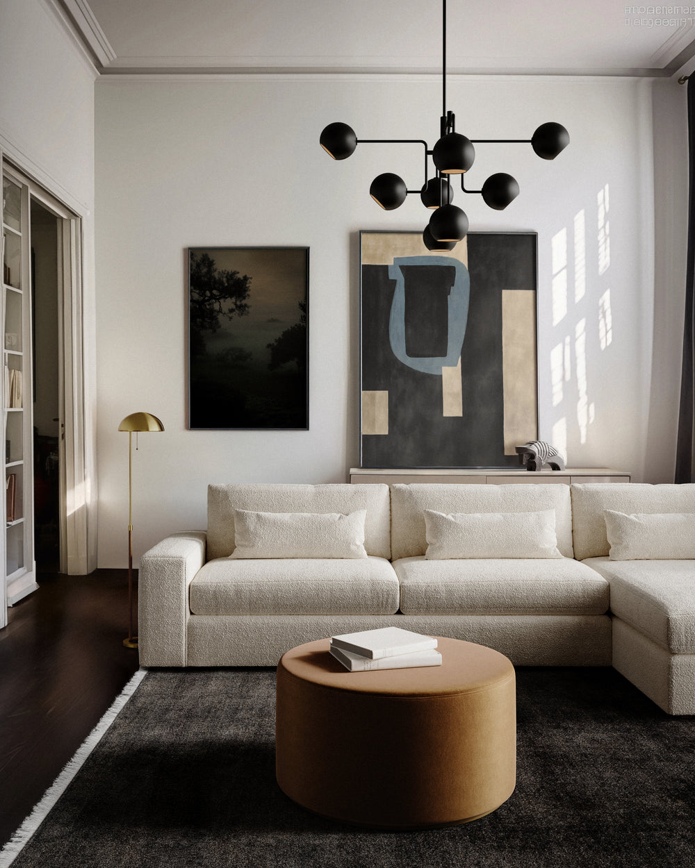 Lemieux et Cie Lacroix Left Chaise Sectional in ivory bouclé, modular sofa in a light-filled sitting room with dark wood floors and white walls.