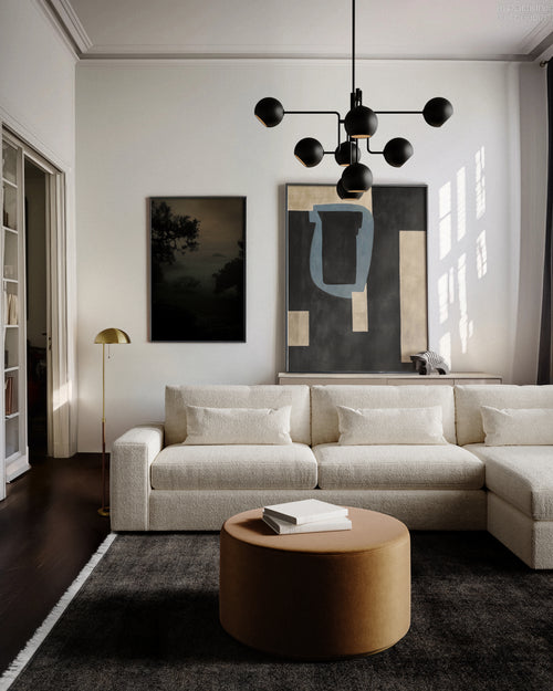 Lemieux et Cie Lacroix Left Chaise Sectional in ivory bouclé, modular sofa in a light-filled sitting room with dark wood floors and white walls.