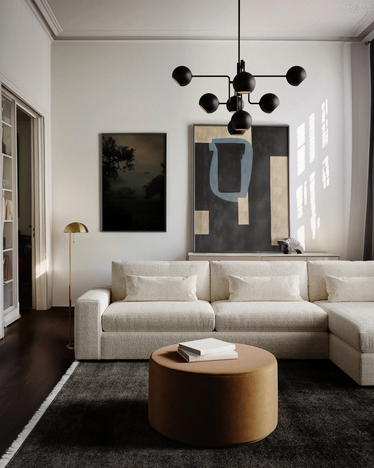 Lemieux et Cie Lacroix Left Chaise Sectional in ivory bouclé, modular sofa in a light-filled sitting room with dark wood floors and white walls.