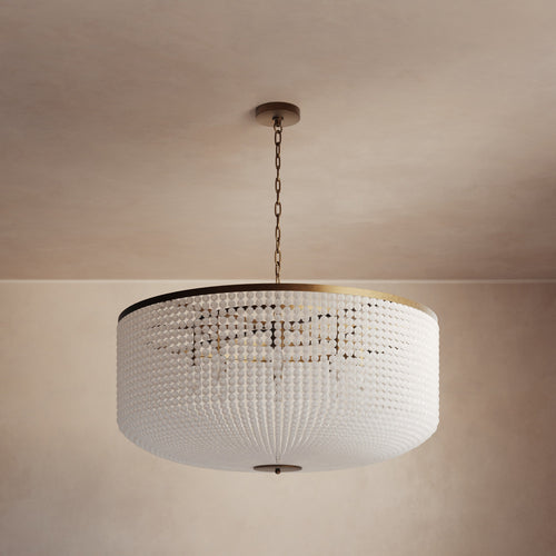 Lemieux et Cie Bellecour Chandelier with hand-strung honed crystal beads and vintage gilded brass frame, shown suspended from ceiling in warm ambient light.
