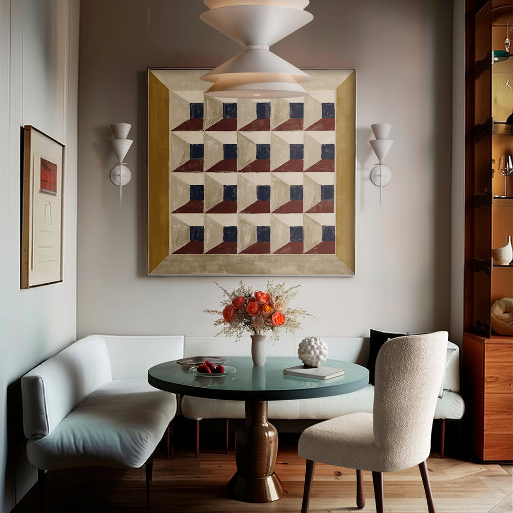 Lemieux et Cie Les Cubes 1 fine art print with geometric pattern in navy, rust and neutral tones, hung above a banquette in a dining room with warm light and wood floors.