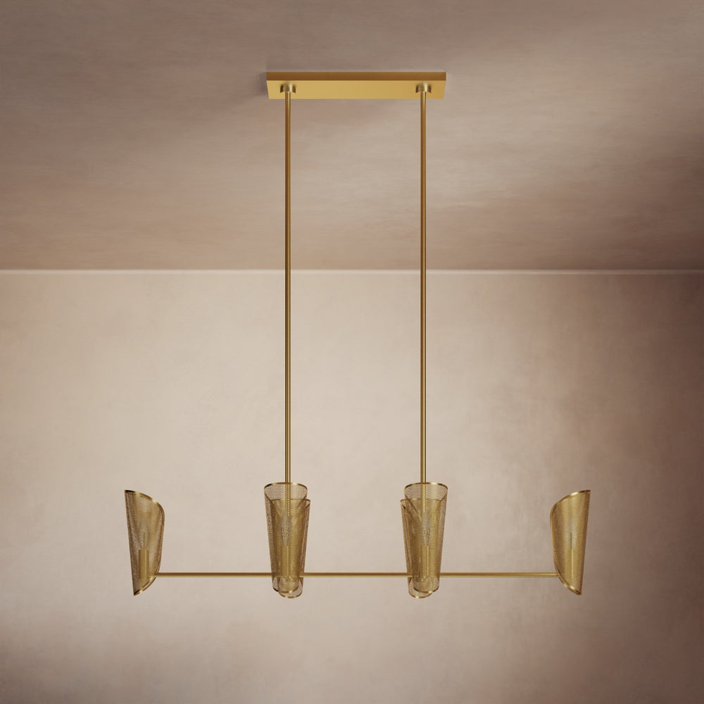 Lemieux et Cie sculptural chandelier with four tapered mesh shades suspended from linear frame, shown against neutral two-tone walls in warm light.