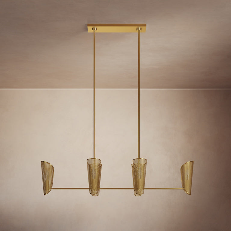 Lemieux et Cie sculptural chandelier with four tapered mesh shades suspended from linear frame, shown against neutral two-tone walls in warm light.