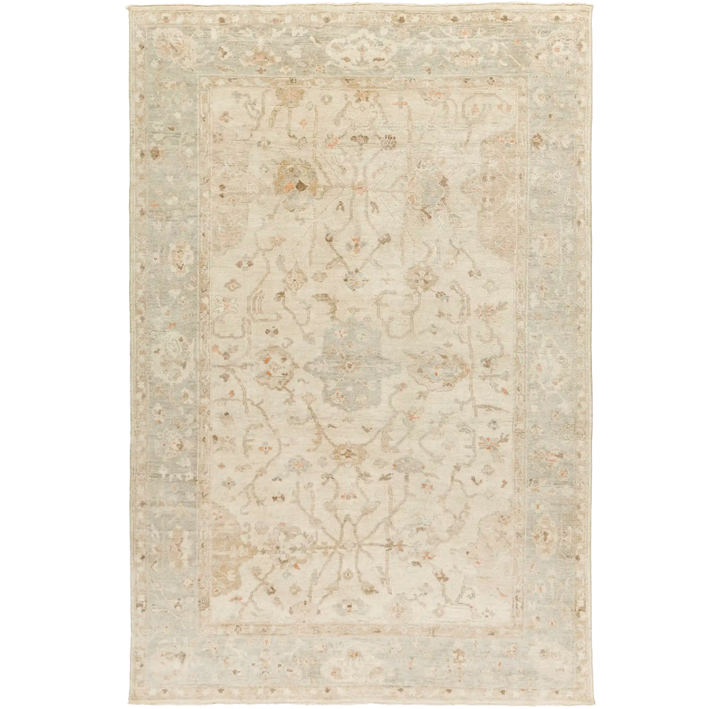 Lemieux et Cie Arabesque Fleurie hand-knotted wool rug in soft ivory and warm neutrals, traditional floral motif shown on white studio backdrop.