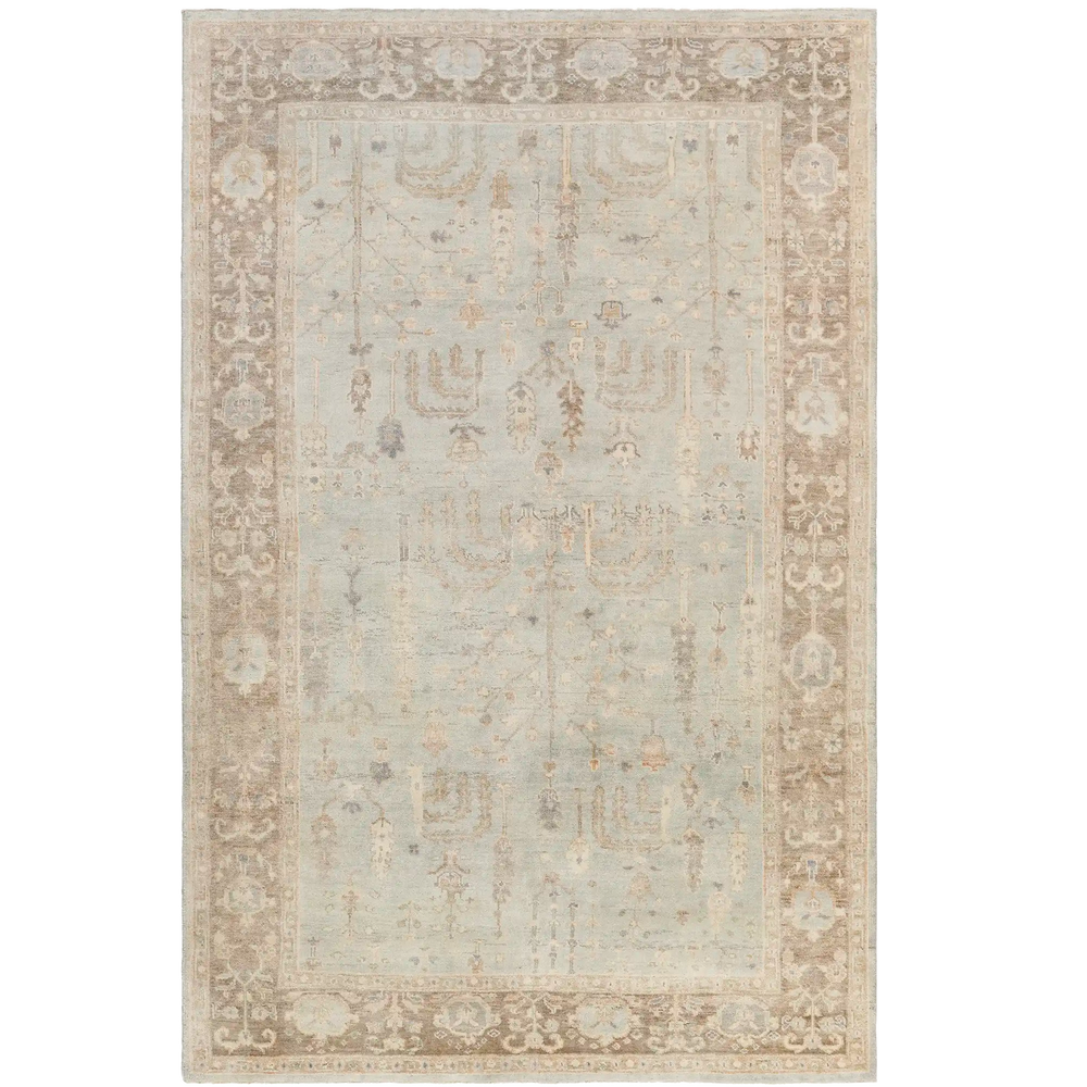 Lemieux et Cie Lafleur Serein Handmade Wool Rug in soft blue-grey and warm taupe, hand-knotted traditional motif rug, shown on white studio backdrop.