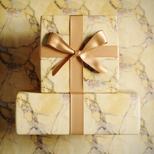 Lemieux et Cie Oro Calcutta Christmas gift wrapping paper inspired by Italian marble in gold and rose.