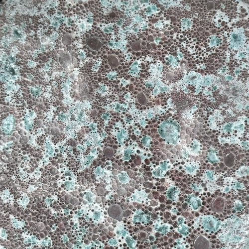 close up showing the glaze and bubbling of the Oxidized Jade ceramic reactive glaze. Handmade for indoor and outdoor use. 