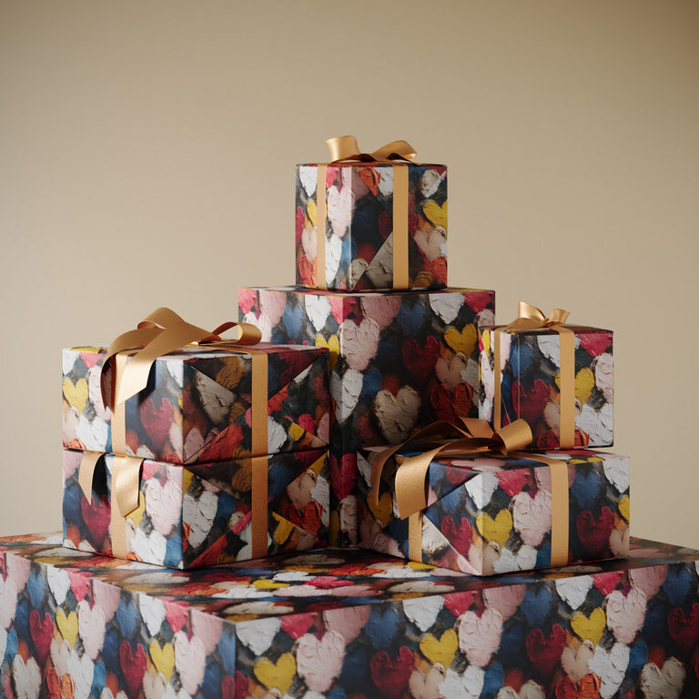 Stack of gifts wrapped in Lemieux et Cie designer wrapping paper: Lemieux et Cie Painterly Hearts cute wrapping paper celebrating visible brushstrokes and organic texture.