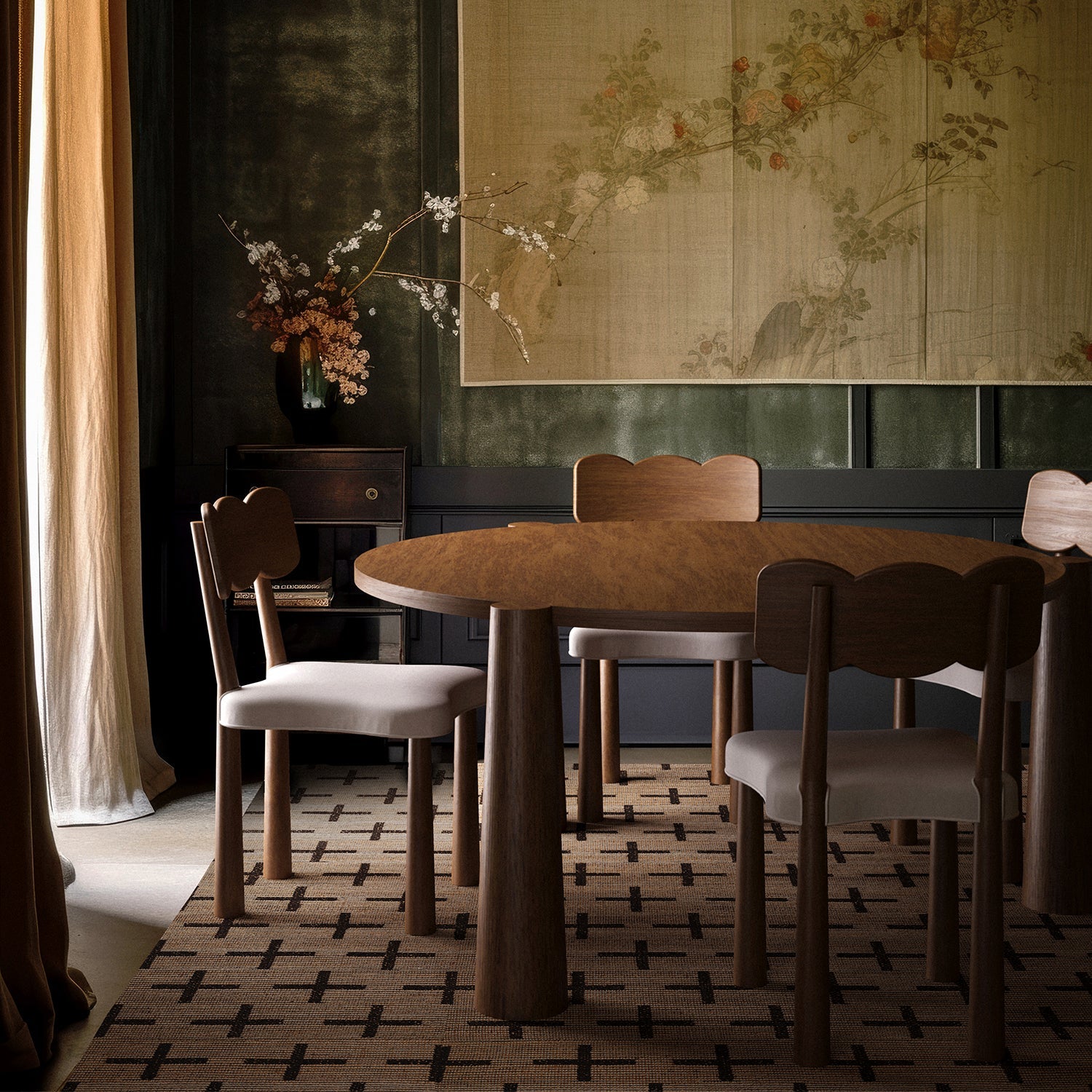 Lemieux et Cie Madeleine Dining Chair with scalloped backrest and upholstered seat, shown in dining room with patterned rug and botanical wall panels.