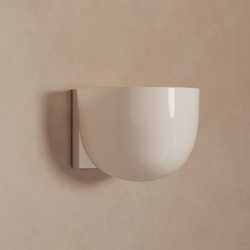 Lemieux et Cie Cheverny Sconce, rounded bowl-form wall light in warm ivory against neutral plaster wall in soft daylight.