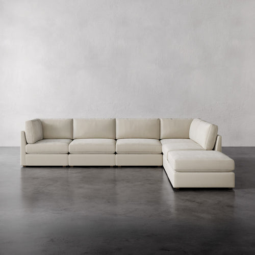 Lemieux Et Cie Chanaux 6-Pc Sectional
Beige sectional sofa on a gray floor with a plain gray wall background