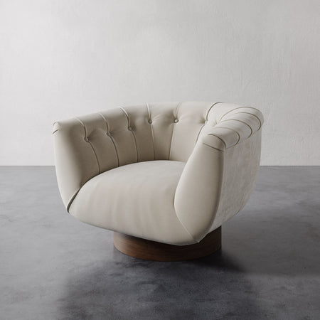 Lemieux et Cie Lune Swivel Chair in Strie Velvet Bisque with a rounded tufted back and sculptural form set against a white wall.