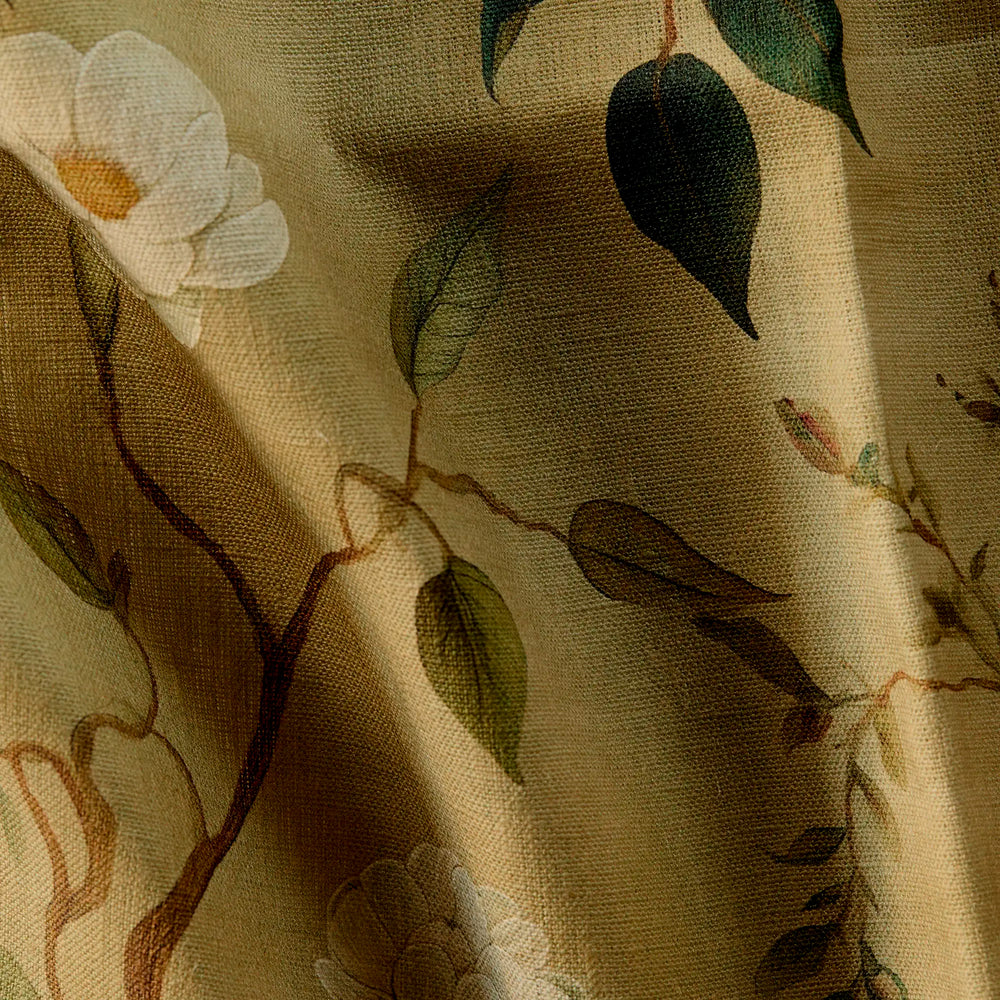 close up of Linen luxury pillow fabric with botanical treillage pattern in antique gold, sienna, and emerald green on linen with natural slub texture