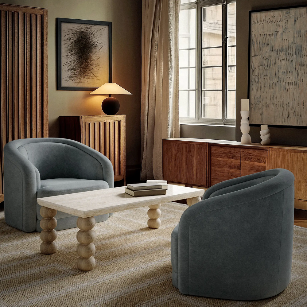 Lemieux et Cie Marquise Blanc Handmade Wool Rug in neutral tones, handwoven area rug shown in a sitting room with dark gray chairs and warm wood furnishings.