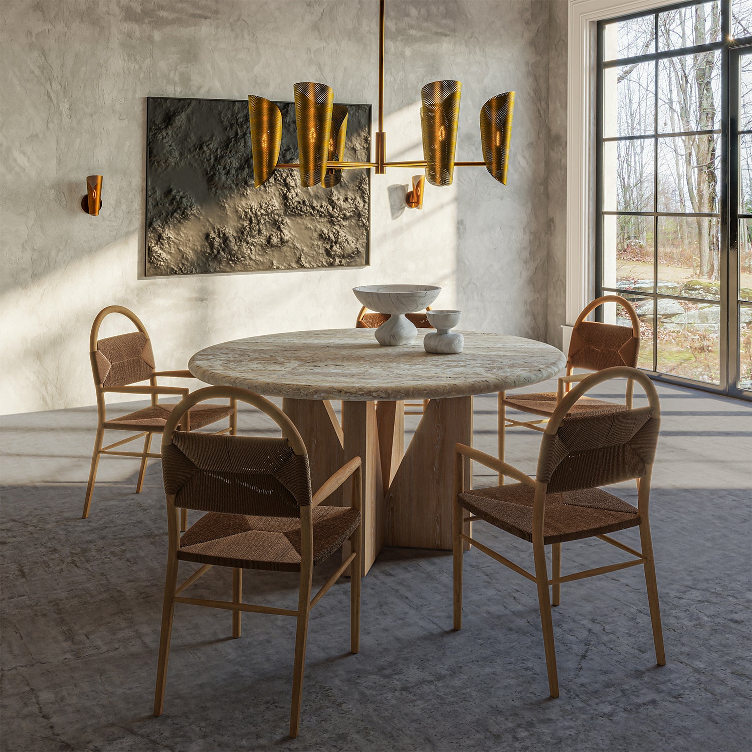 Lemieux et Cie Plivot 6 Light Large Chandelier, a luxury lighting fixture above the Elysées Dining Table with Pernelle Dining Arm Chairs and two Plivot Single Sconces.