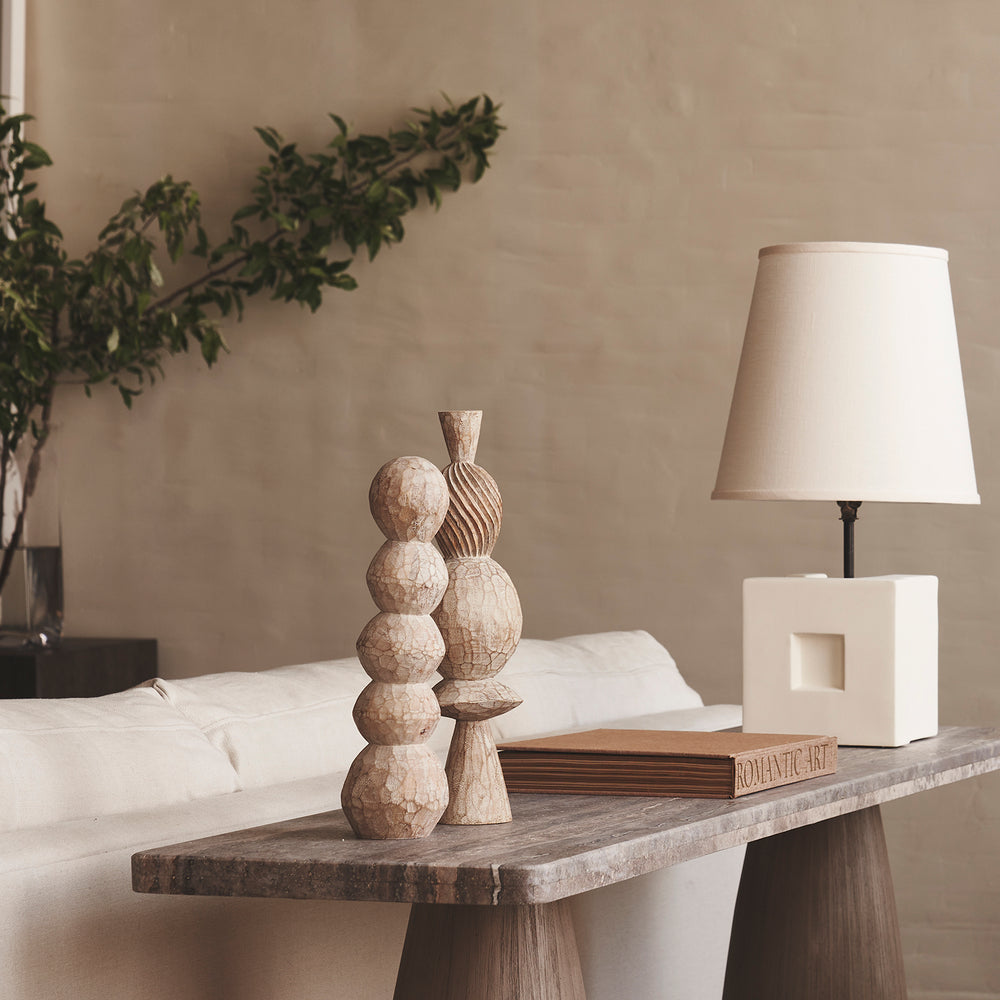 Lemieux et Cie Roule Pillar in wood, sculptural mini pillar with stacked spherical forms, styled on weathered wood table in neutral room with soft daylight.