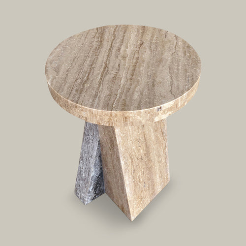Lemieux et Cie Borel Side Table in walnut with low sheen finish, sculptural side table with angled geometric base and round top, shown on neutral studio backdrop.