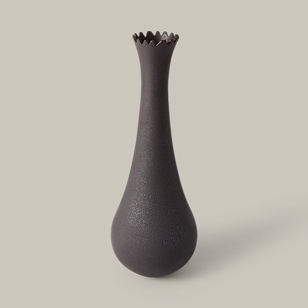 Lemieux et Cie Fenouil Vase in black matte finish, tall teardrop form with scalloped rim, shown on neutral studio backdrop.