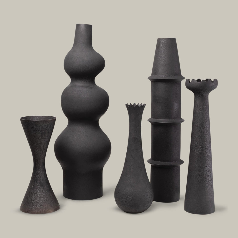 Lemieux et Cie Deoune Vase in black, sculptural ceramic vases in varying organic forms grouped on neutral studio backdrop.