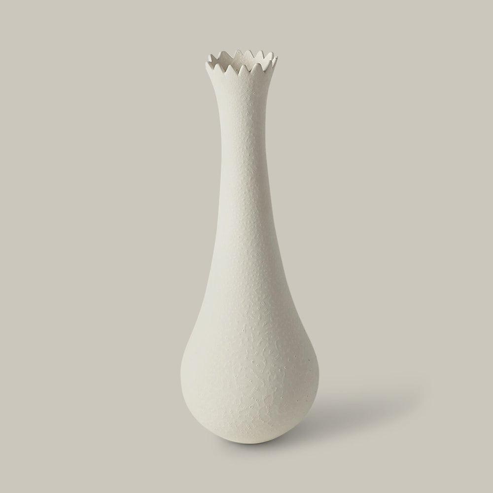 Lemieux et Cie Fenouil Vase in matte white ceramic, tapered form with scalloped rim, shown on neutral studio backdrop.