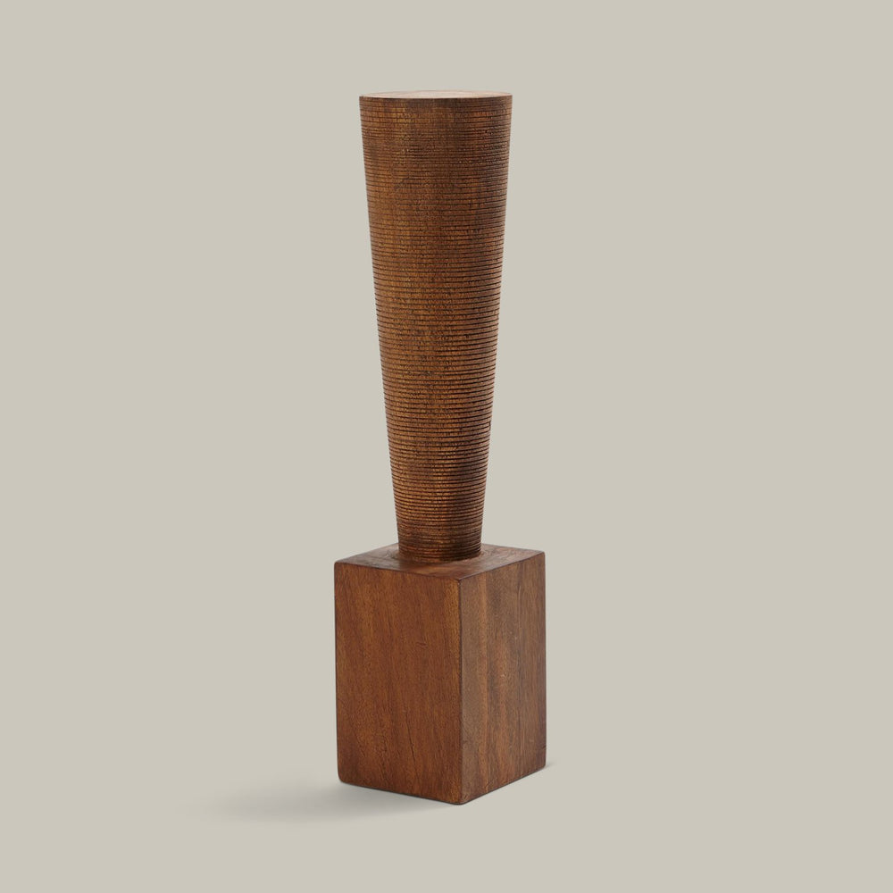 Lemieux et Cie Rivoli Pillar, sculptural wooden totem with ribbed tapered form on block base, shown on neutral studio backdrop.