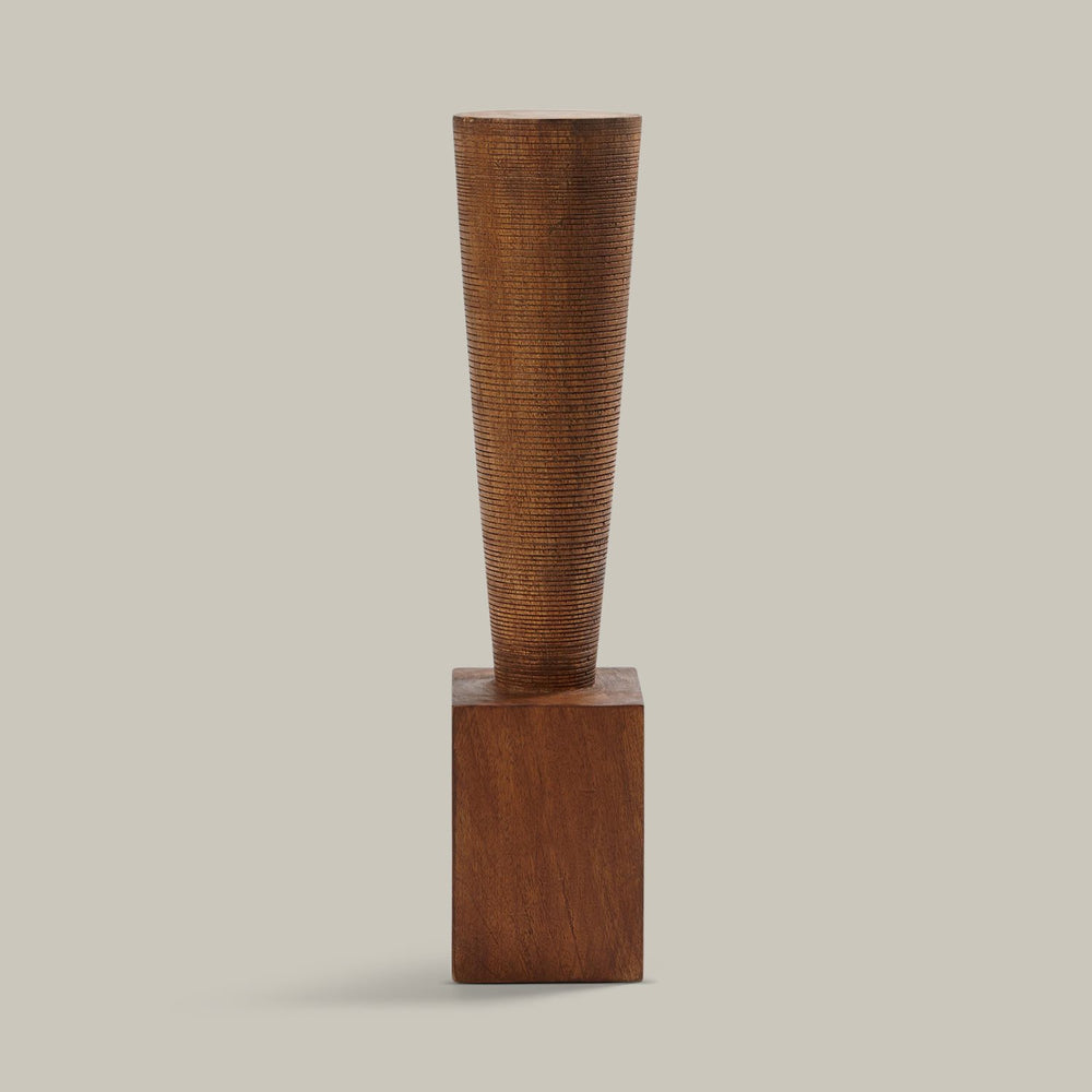 Lemieux et Cie Rivoli Pillar, tapered wooden totem with ribbed texture on square base, sculptural accent object shown on white studio backdrop.