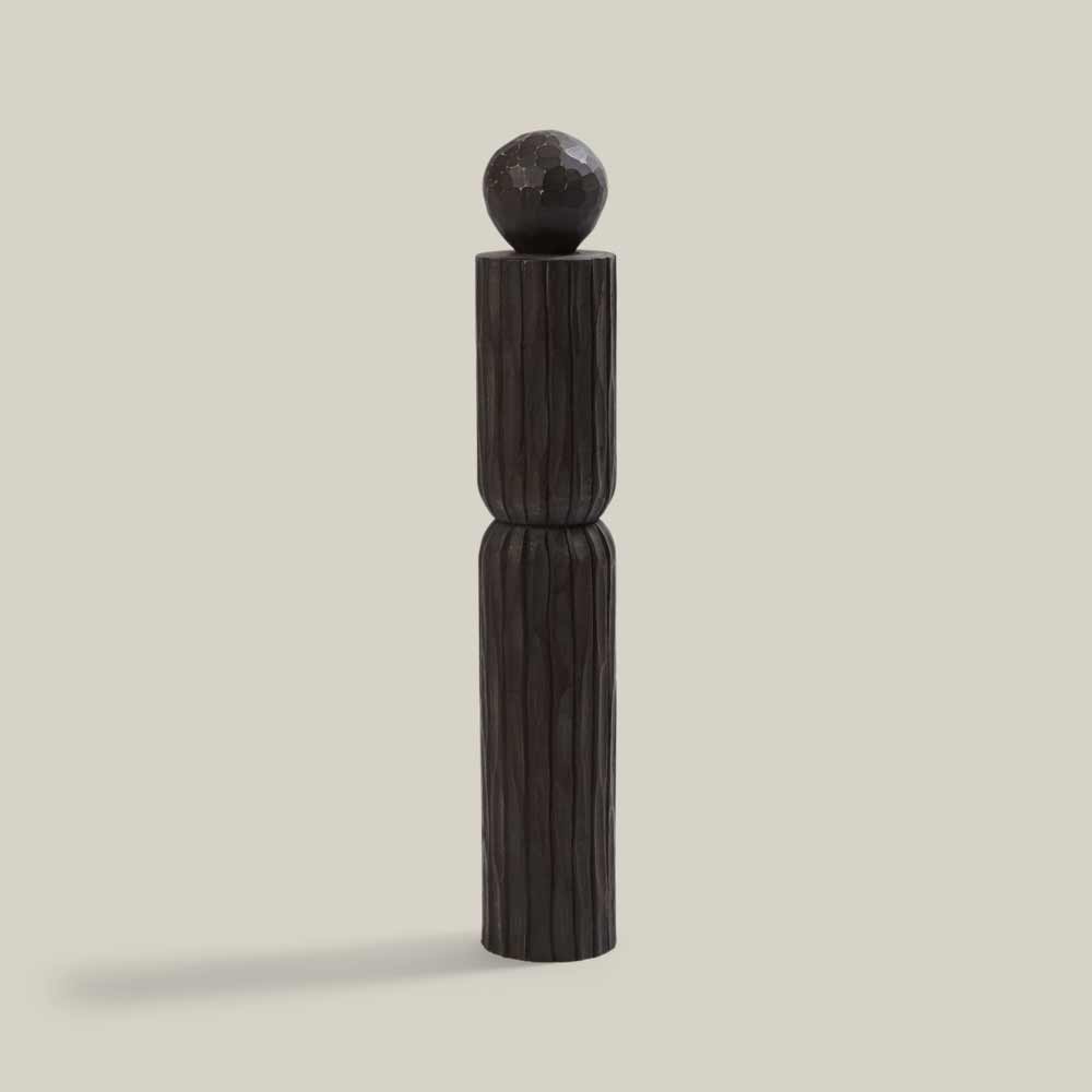 Lemieux et Cie Amelot Pillar in dark finish, fluted wooden column topped with faceted sphere, shown on neutral studio backdrop.