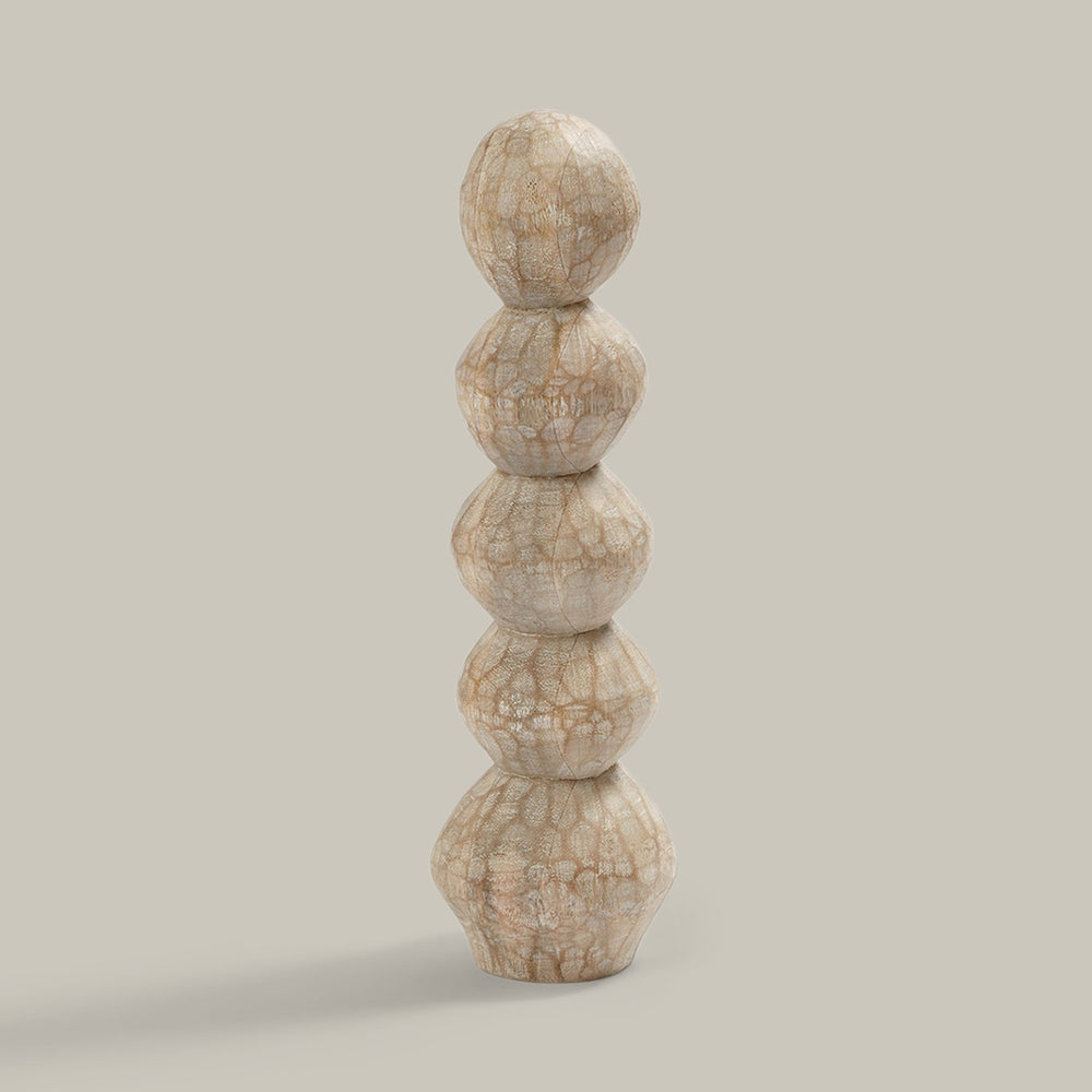 Lemieux et Cie Roule Pillar, stacked organic wood sculpture with textured finish, shown on neutral studio backdrop.