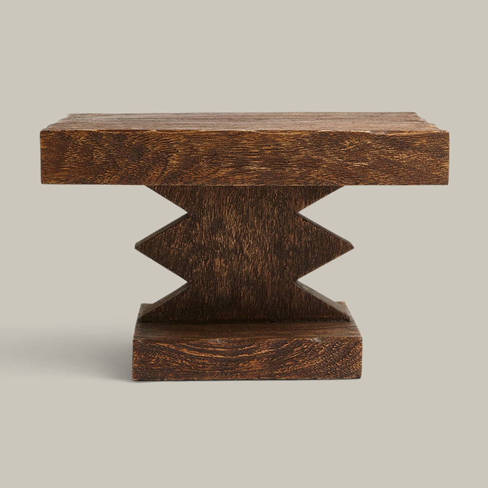 Lemieux et Cie Davin Pedestal, sculptural geometric base with visible wood grain, low-profile pedestal shown on neutral studio backdrop.