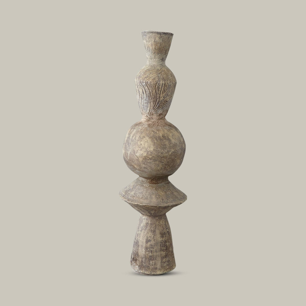 Lemieux et Cie Honore Totem, sculptural stacked-form pillar with textured surface and aged finish, shown on neutral backdrop.