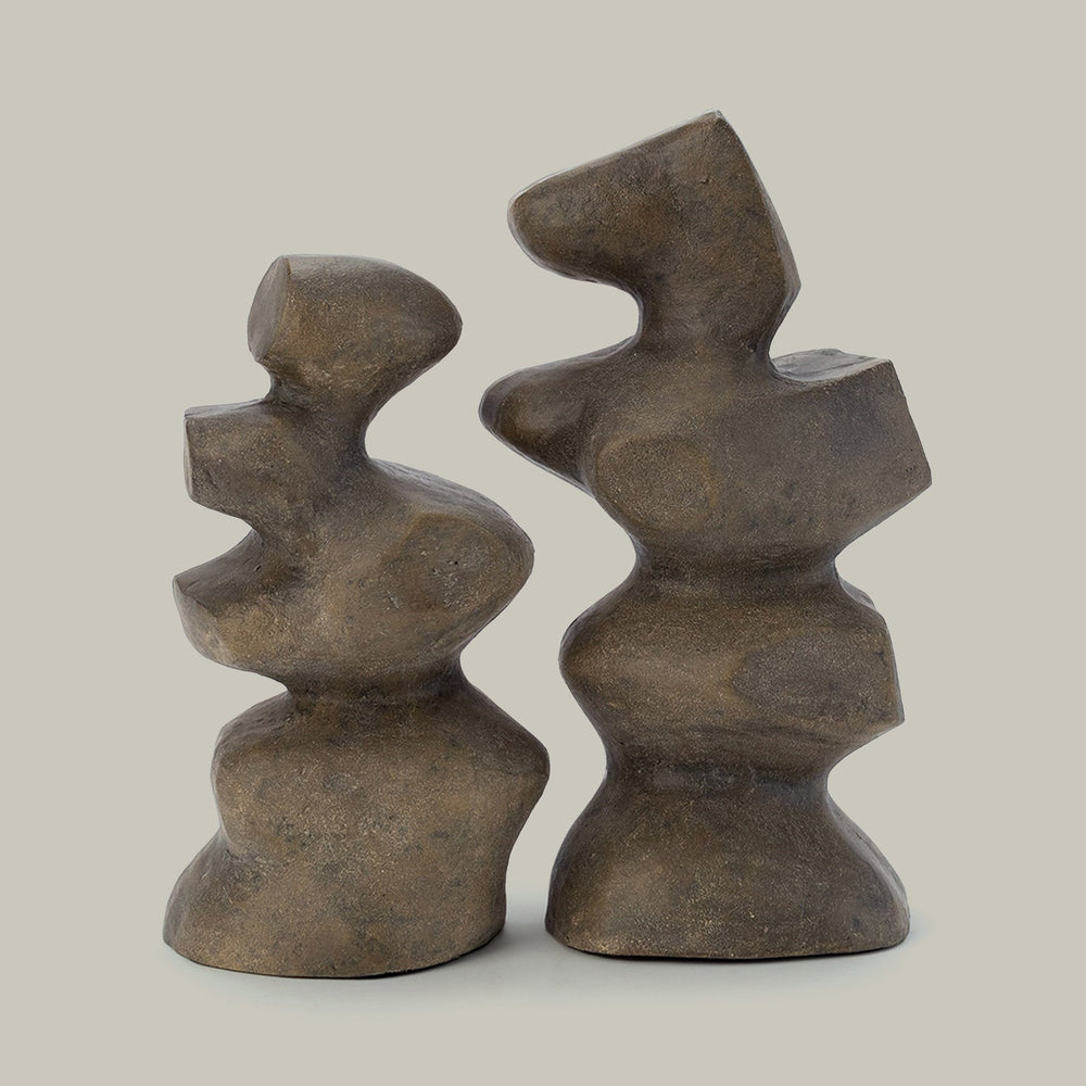 Lemieux et Cie Mguyon Sculpture pair in hand-cast aluminum, organic sculptural forms with warm patina, shown on neutral studio backdrop.