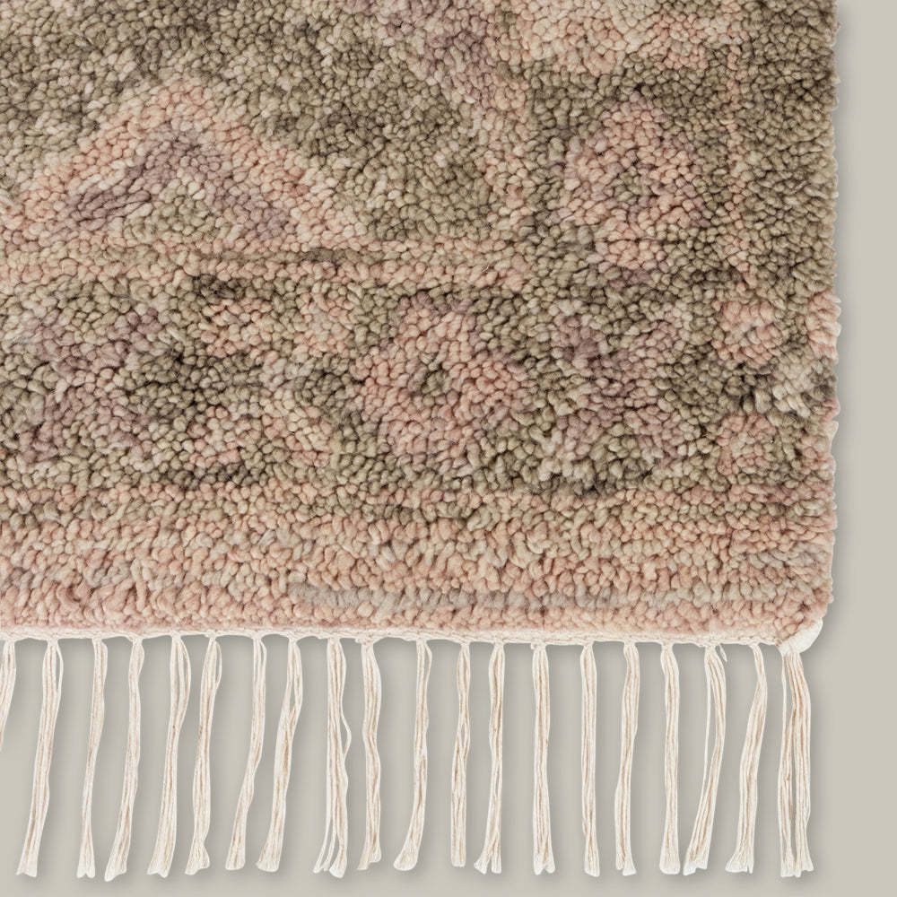 Lemieux et Cie Doukkala Rug in mauve and taupe hand-knotted wool with hand-shorn pile, textured fringe detail shown on white backdrop.